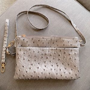 Grey, faux ostrich crossbody/wristlet. New without tags. Never used.